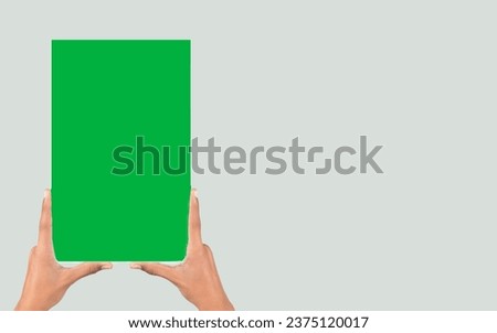 Hands showing green blank sign. Model women hand holding white blank paper isolated on white background with clipping path. Copy space. Human hand sign horizontal notice advertisement magazine. 