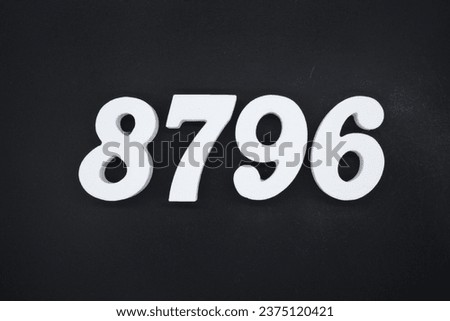 Black for the background. The number 8796 is made of white painted wood.