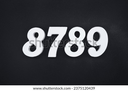 Black for the background. The number 8789 is made of white painted wood.