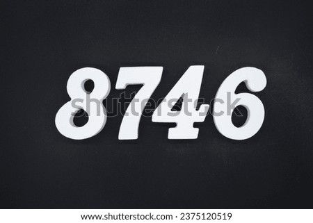 Black for the background. The number 8746 is made of white painted wood.