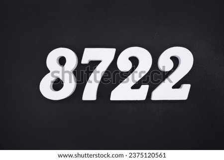 Black for the background. The number 8722 is made of white painted wood.