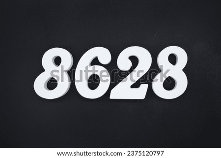 Black for the background. The number 8628 is made of white painted wood.