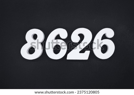 Black for the background. The number 8626 is made of white painted wood.