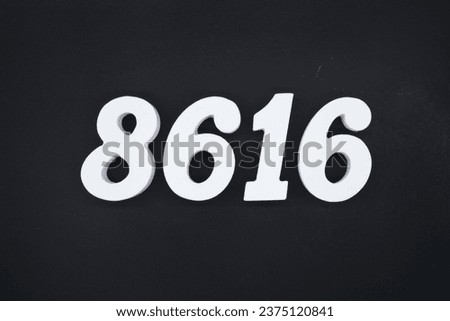 Black for the background. The number 8616 is made of white painted wood.