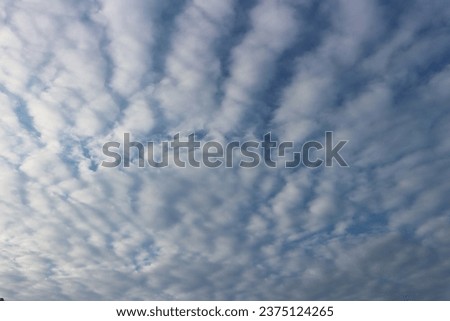 Beautiful sky with clouds  Many white cirrocumulus clouds. Royalty-Free Stock Photo #2375124265