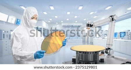 Worker or engineer wears medical protective suit or white coverall suit with silicon wafer Royalty-Free Stock Photo #2375129801