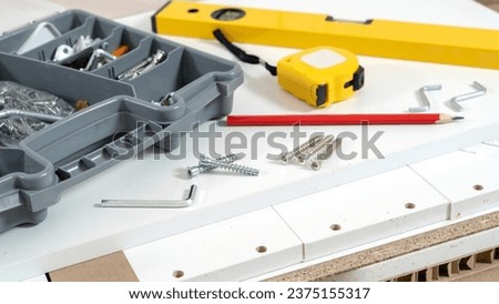 accessories for assembling furniture before assembly. High quality photo Royalty-Free Stock Photo #2375155317