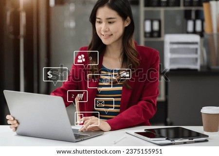 Social media and Marketing virtual icons screen of woman typing keyboard with laptop computer at office at morning light.