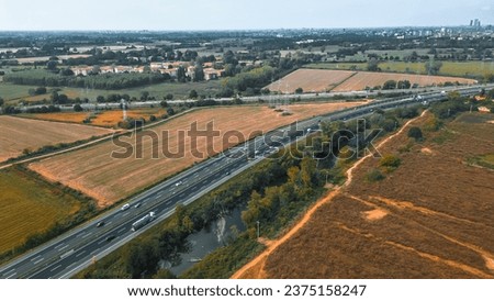 Aerial view of a section of the Italian motorway. near San Donato Milanese and Milan, Italy. (Italiano: Autostrada del sole)