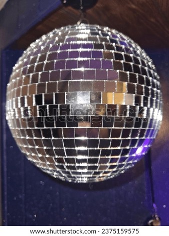 picture of a disco ball with camera flash
