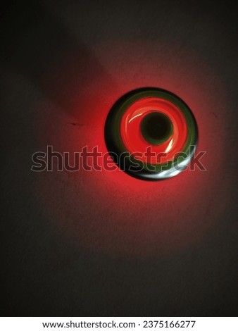Picture the rotation of beyblade game light in dark light.