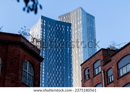 The skyscrapers of Deansgate Square apartment complex pictured under a blue sky in Manchester in October 2023.