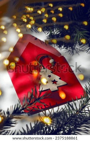 Christmas and New Year, celebration. Red greeting card, Christmas decorations, wishing, planning. String lights in the night