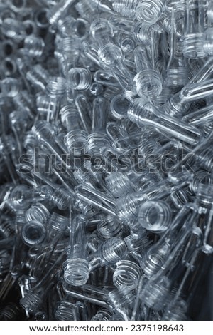 Close, detailed image of PET preform blanks, the foundation for plastic bottle creation.