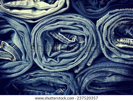 background of a stack rolled jeans (vintage) Royalty-Free Stock Photo #237520357