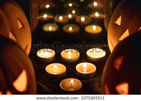 Halloween pumpkin decoration with candle Royalty-Free Stock Photo #2375205511