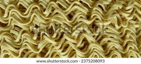 dry yellow noodle texture close up.  texture, pattern, background