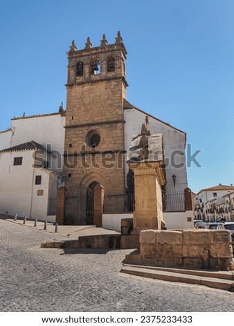 Catholic church or Iglesia de Padre Jesús in Ronda, Spain. Construction dates back to the 16th century. The stone masonry bell tower and entrance is gothic style, other part - renaissance architecture