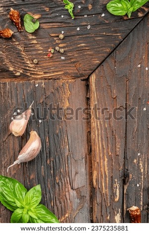 wooden background with spices and herbs, cooking background, menu. vertical image. top view. place for text.