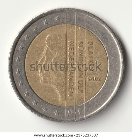 Circulating coin of the value of 2 (two) euro issued by Netherlands in 2002 depicting Beatrix (Queen of the Netherlands). Image isolated on white background.