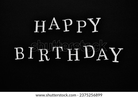 minimalistic happy birthday background - wite write on the black background 