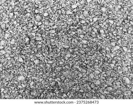 Asphalt road background, close view. Highway pavement texture macro view. Sand and stones
