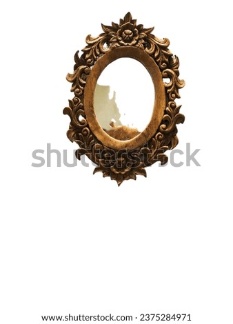 A mirror with a wooden frame that is designed to have a beautiful pattern.
