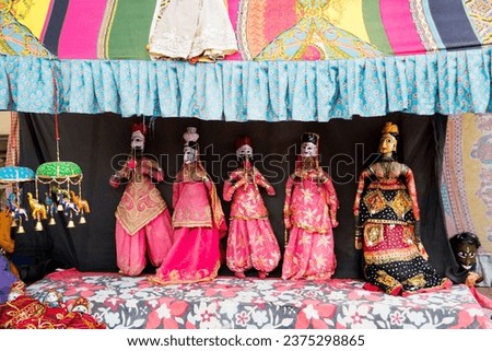 Puppets on the wall for sale on street of Jaipur, India Royalty-Free Stock Photo #2375298865