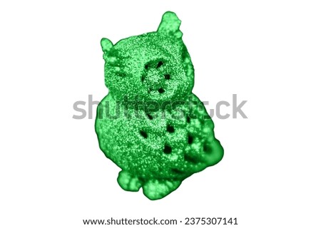 Green owl hanging as decorations on a Christmas tree, close-up, isolated on a white background