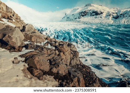 Amazing old glacier landscape photo. Beautiful nature scenery photography with rocky mountains on background. Idyllic scene. High quality picture for wallpaper, travel blog, magazine, article
