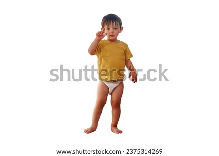 Baby is standing on the window sill, gazing out at the sky and risking a life-changing accident, isolated on white background. Kid aged two years