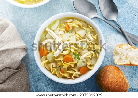 Traditional chicken noodle soup with chicken, carrots, celery and egg noodles