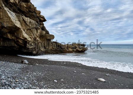 Pebble and black sand beach in Ajuy, Fuerteventura, Spain Royalty-Free Stock Photo #2375321485