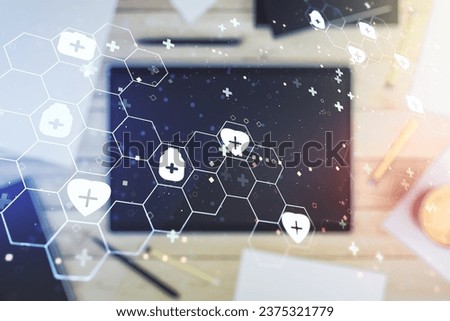Double exposure of creative abstract medical hologram and digital tablet on background, top view. Healthcare technolody concept