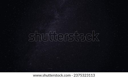 The Milky Way with falling meteorites. Space. A bright colored stripe is a trace of a meteorite. Nebulae and constellations are visible. Andromeda glows brightly. Astrophotography