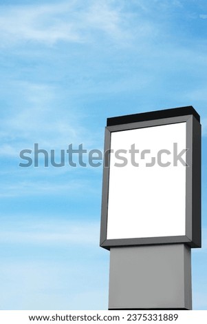 Empty signboard against blue sky. Mock-up for design