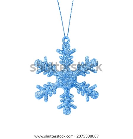 Hanging blue snowflake. Christmas tree ornament isolated on a white background. Stock photo