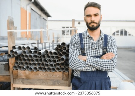 Man chooses metal profile for construction.