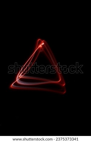 Abstract red lights in the shape of a triangle, white tones, dark background, shapes in the air, luminous lines in darkness, no people, long exposure photography, moving fine lines