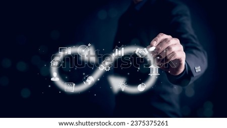 Business people hold Infinity symbol with technology global marketing online in business connection network economy strategy of investment, banking and financial data exchange for business growth. Royalty-Free Stock Photo #2375375261