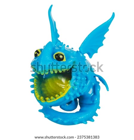 Figures of plastic dragons for children's games isolated on a white background close-up