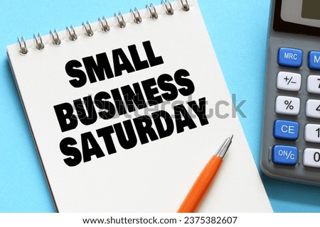 Small Business Saturday words in an office notebook. Concept for business. Royalty-Free Stock Photo #2375382607