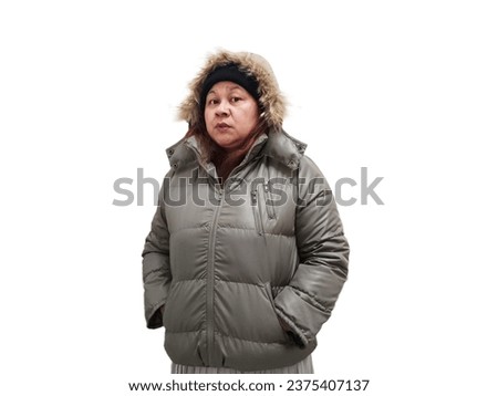 Indonesian woman wearing winter jacket, cold expression. Isolated on white background