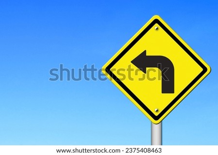 Yellow Turn Left Sign with Sky Background Royalty-Free Stock Photo #2375408463