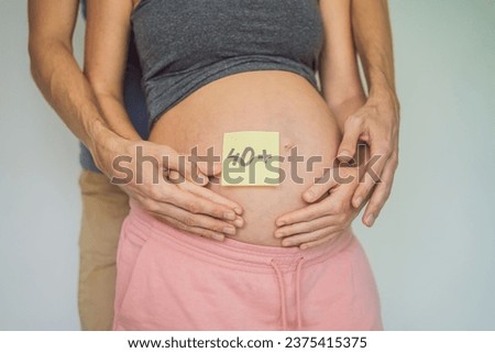 Radiant and confident, a woman in her 40s embraces pregnancy, defying age stereotypes and celebrating the beauty of motherhood Royalty-Free Stock Photo #2375415375