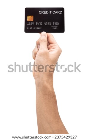 The man's hand holds black credit card isolated on white background with clipping path. Royalty-Free Stock Photo #2375429327