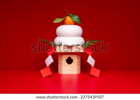 "Kagamimochi" is an offering to the gods.
"Kagamimochi" is placed in the center of a red background.
High pedestal. Using rice cakes made of ceramic. Royalty-Free Stock Photo #2375439507