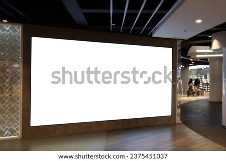 mockup of large led screen a front of shop in shopping mall. Royalty-Free Stock Photo #2375451037