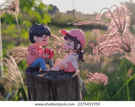 Couple dolls.Loving toy concept. Valentines Day. Love heart. hugging. Red heart,dolls in love .Couple dolls in love romantic with nature background.