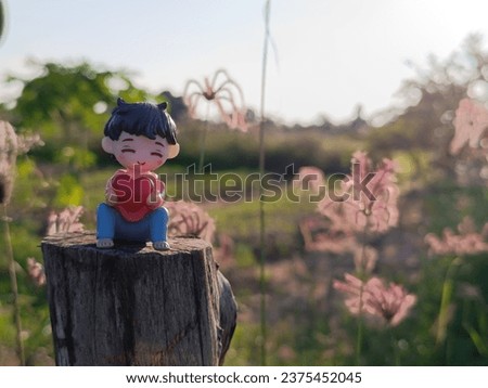 Loving toy concept. Valentines Day. Love heart. hugging. Red heart,dolls in love .dolls in love romantic with nature background.